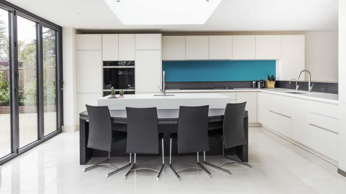 White Handleless Kitchen with Dinner table Island